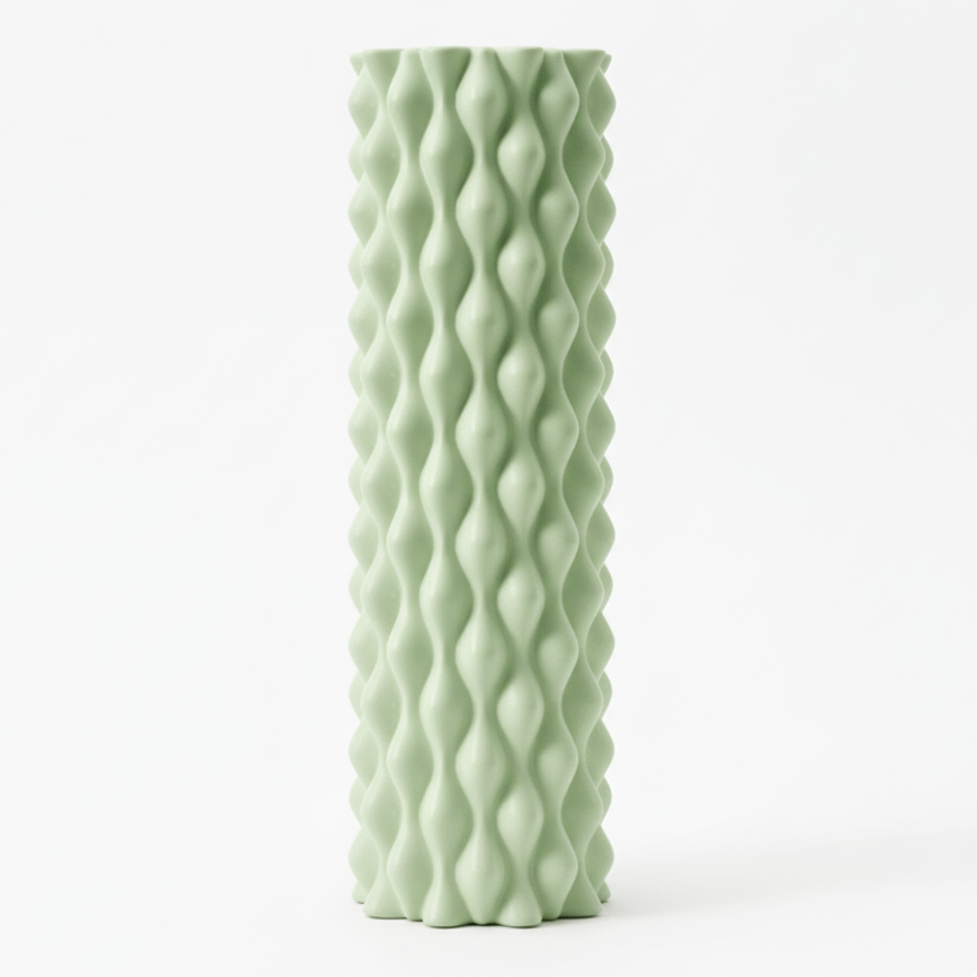 Sage Green Foam Yoga Roller With Wave like bubble pattern.